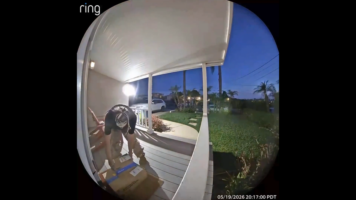 Ring doorbell camera still — package theft on porch